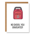 AED – “No Shock, You Graduated!” Card showing a red AED defibrillator with a small heart symbol with front cover text: No shock, you graduated!