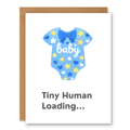 Hello Baby Greeting Card -Blue showing a blue baby onesie with stars, hearts, and a bow with front cover text: baby. Tiny Human Loading...