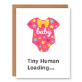 Tiny Human Loading Baby Card - Pink showing a pink baby onesie with stars, hearts, and a bow with front cover text: baby. Tiny Human Loading...