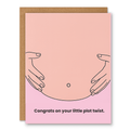 Congrats On Your Little Plot Twist Pregnancy Card showing a simple line drawing of a pregnant belly on a soft pink background with front cover text: Congrats on your little plot twist.