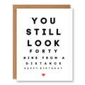 You Still Look 49 (From a Distance) Birthday Card showing eye-chart-inspired black typography with a small red heart with front cover text: You still look forty nine from a distance. Happy birthday