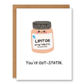 You’re Out-Statin Card (Cholesterol Meds Pun) showing a cute prescription bottle labelled Lipitor with cholesterol-medication wordplay with front cover text: You’re out-STATIN.