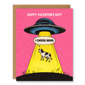 I Choose Moo UFO Greeting Card showing a UFO beaming up a cow on a bright pink Valentine background with front cover text: Happy Valentines Day! I choose moo