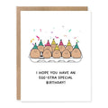 Pun Egg Birthday Card - Funny Greeting Card For Him showing a carton of smiling eggs in party hats with confetti with front cover text: I hope you have an egg-stra special birthday!
