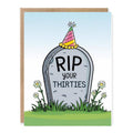 Funny 40th Birthday Card RIP 30s showing a playful tombstone marked RIP your thirties with a tiny birthday party hat, flowers, and grass with front cover text: RIP your thirties