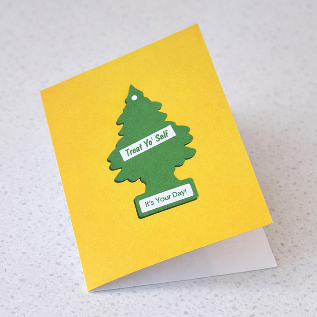 Treat Yo' Self Birthday Card | Air Freshener Design showing a green tree-shaped air freshener on a bright yellow background with front cover text: Treat Yo’ Self. It’s Your Day!